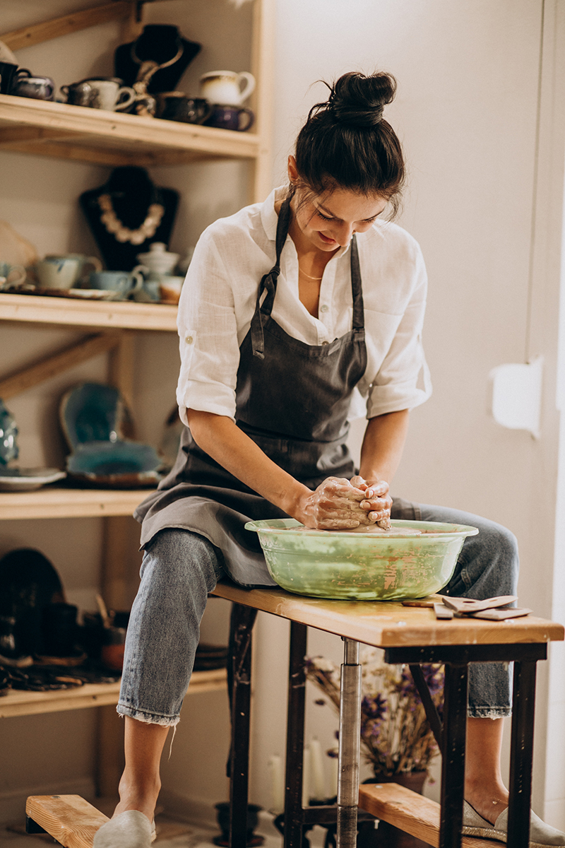 Woman craftmaster at a pottery shop
